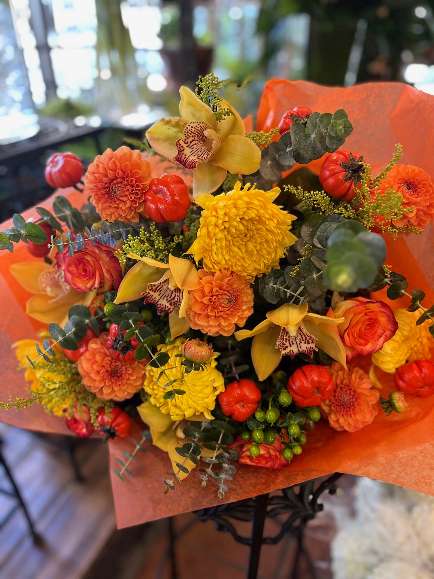 
                    
                      Orange rose, dahlia, cymbidium orchid heads, ruscus and calla lily autumn bouquet – Jerome Florists NYC
                    
                  