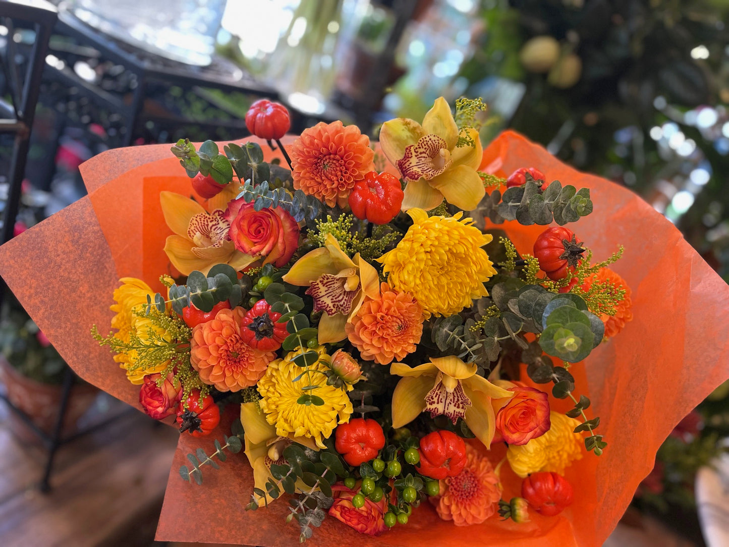 
                    
                      Orange rose, dahlia, cymbidium orchid heads, ruscus and calla lily autumn bouquet – Jerome Florists NYC
                    
                  