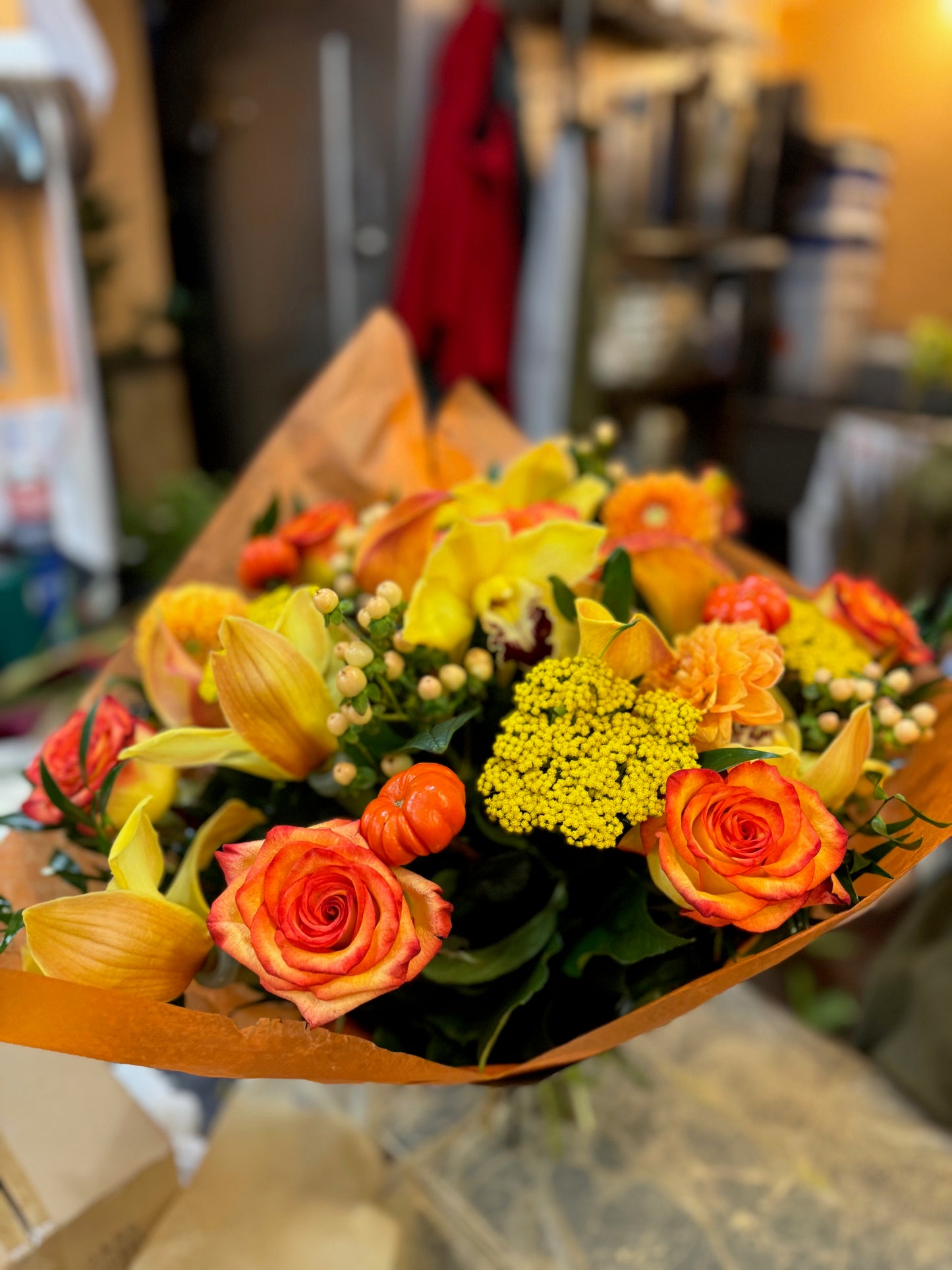 
                    
                      Orange rose, dahlia, cymbidium orchid heads, ruscus and calla lily autumn bouquet – Jerome Florists NYC
                    
                  