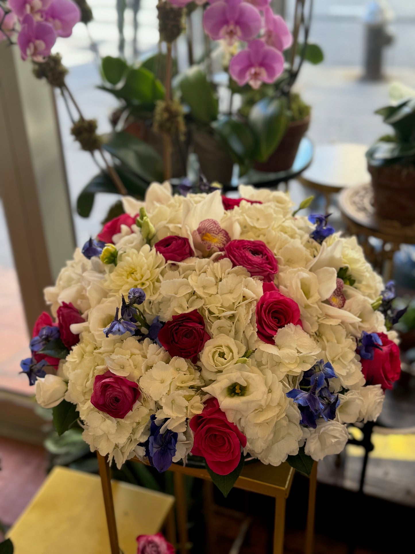
                    
                      White hydrangea cymbidium orchid rose and ranunculus premium Round centerpiece – Jerome Florists NYC
                    
                  