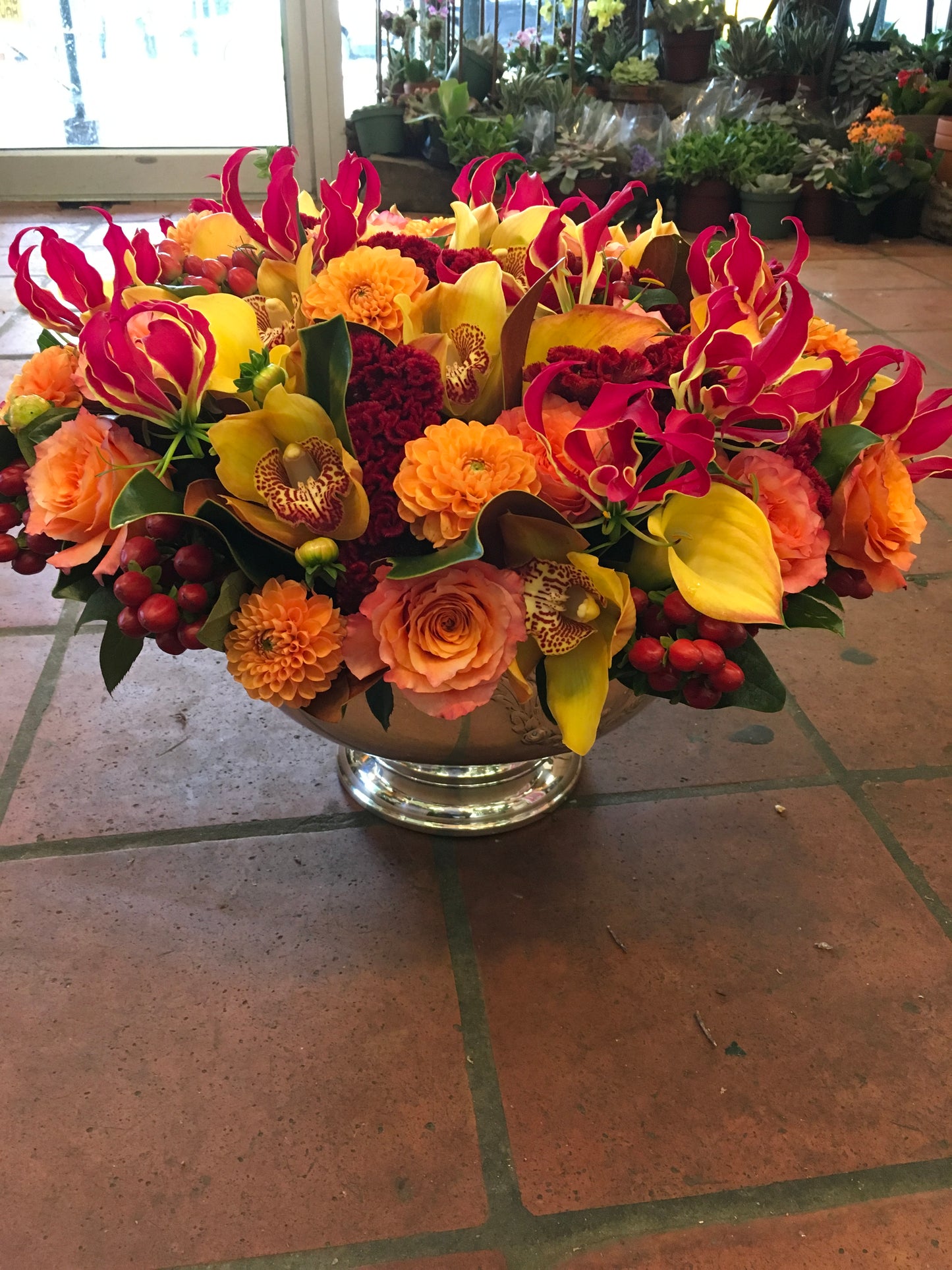 Vivid rose gloriosa lily calla lily and red berry centerpiece – Jerome Florists NYC