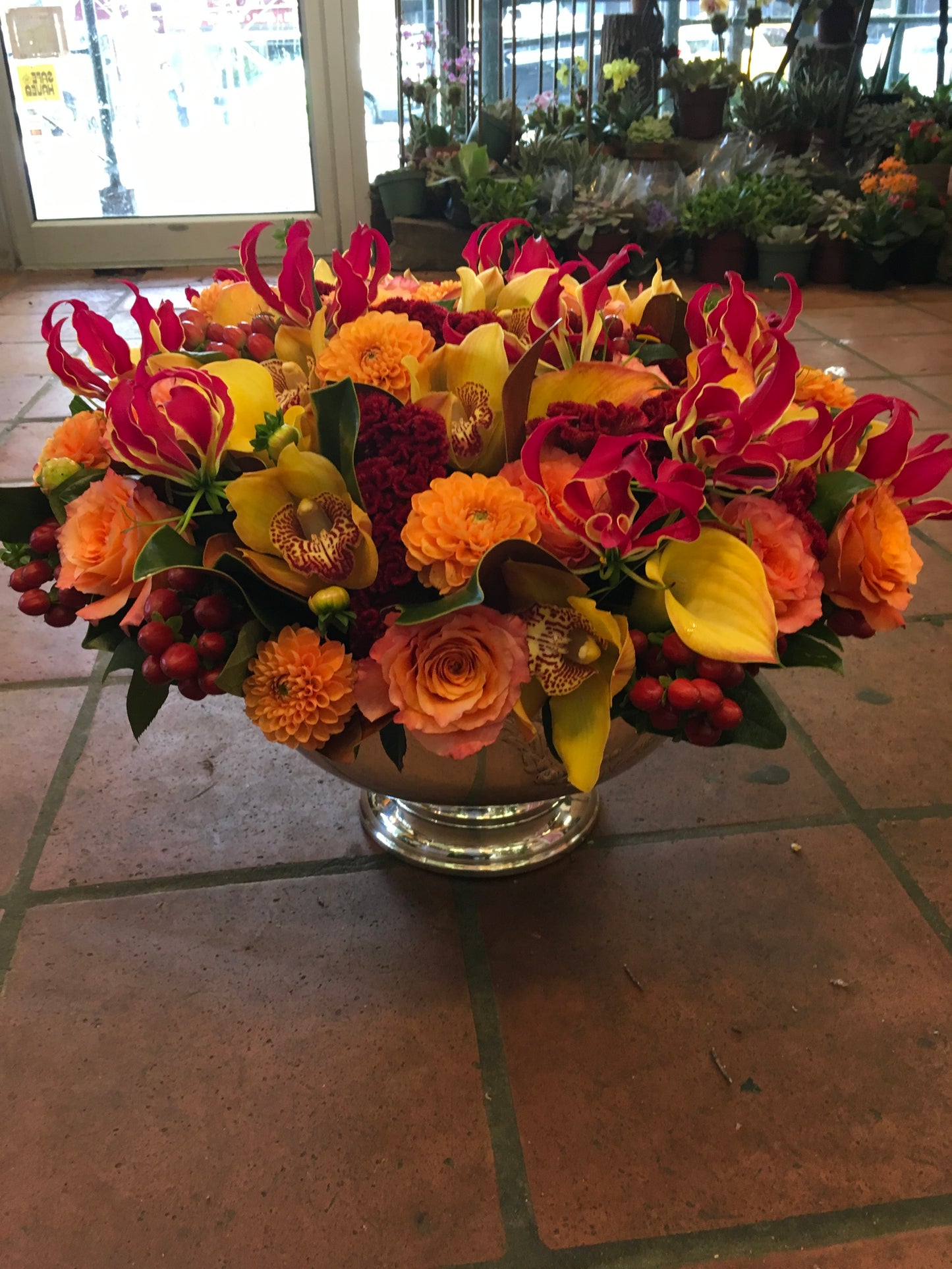 
                    
                      Vivid rose gloriosa lily calla lily and red berry centerpiece – Jerome Florists NYC
                    
                  