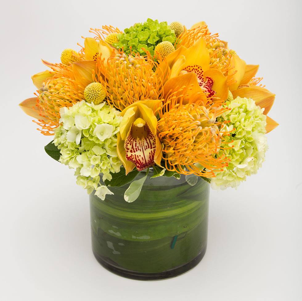 Bright yellow hydrangea pincushion and orchid sunny arrangement – Jerome Florists NYC