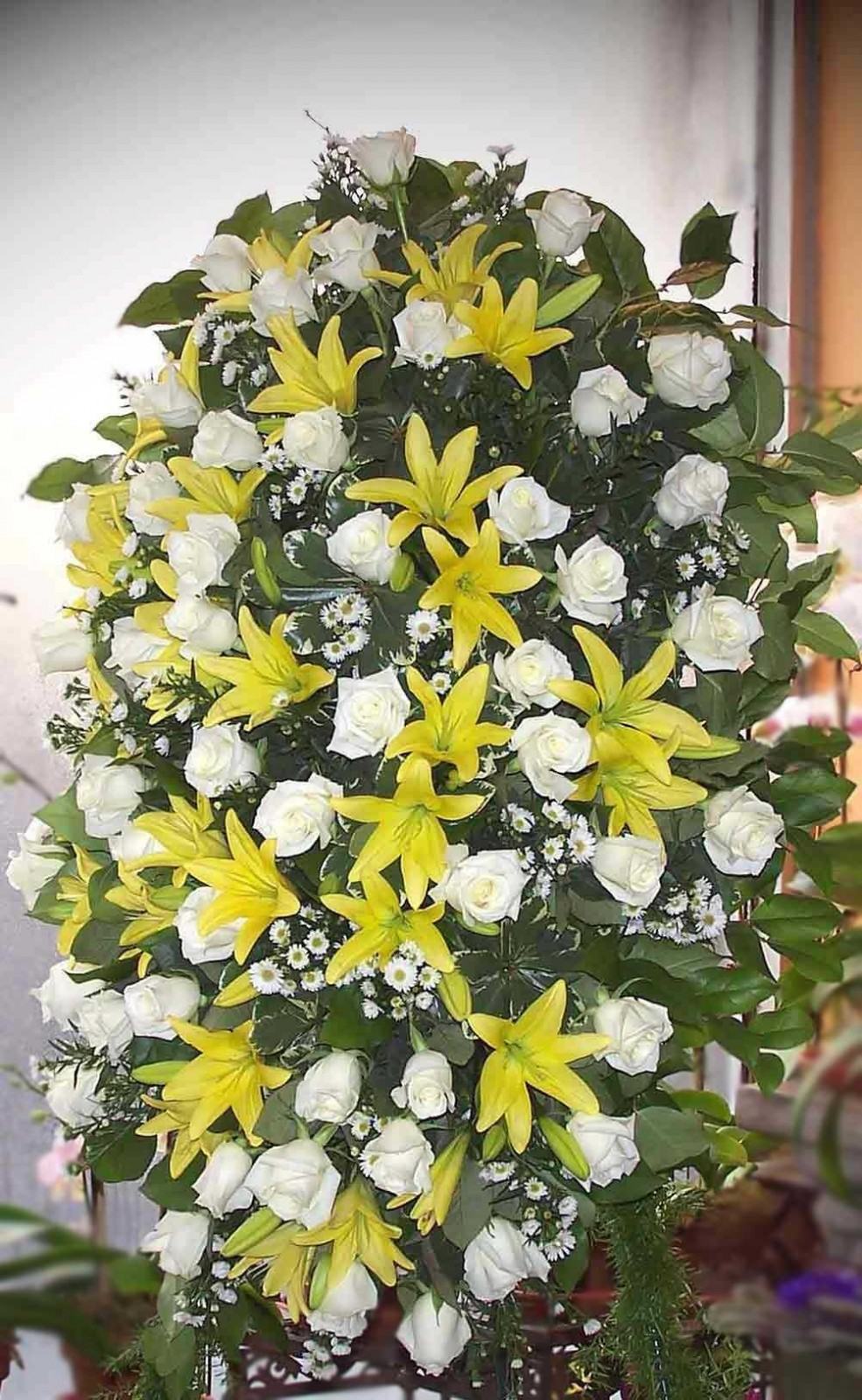Large sympathy spray with white roses and yellow lilies on an easel - Jerome Florists NYC